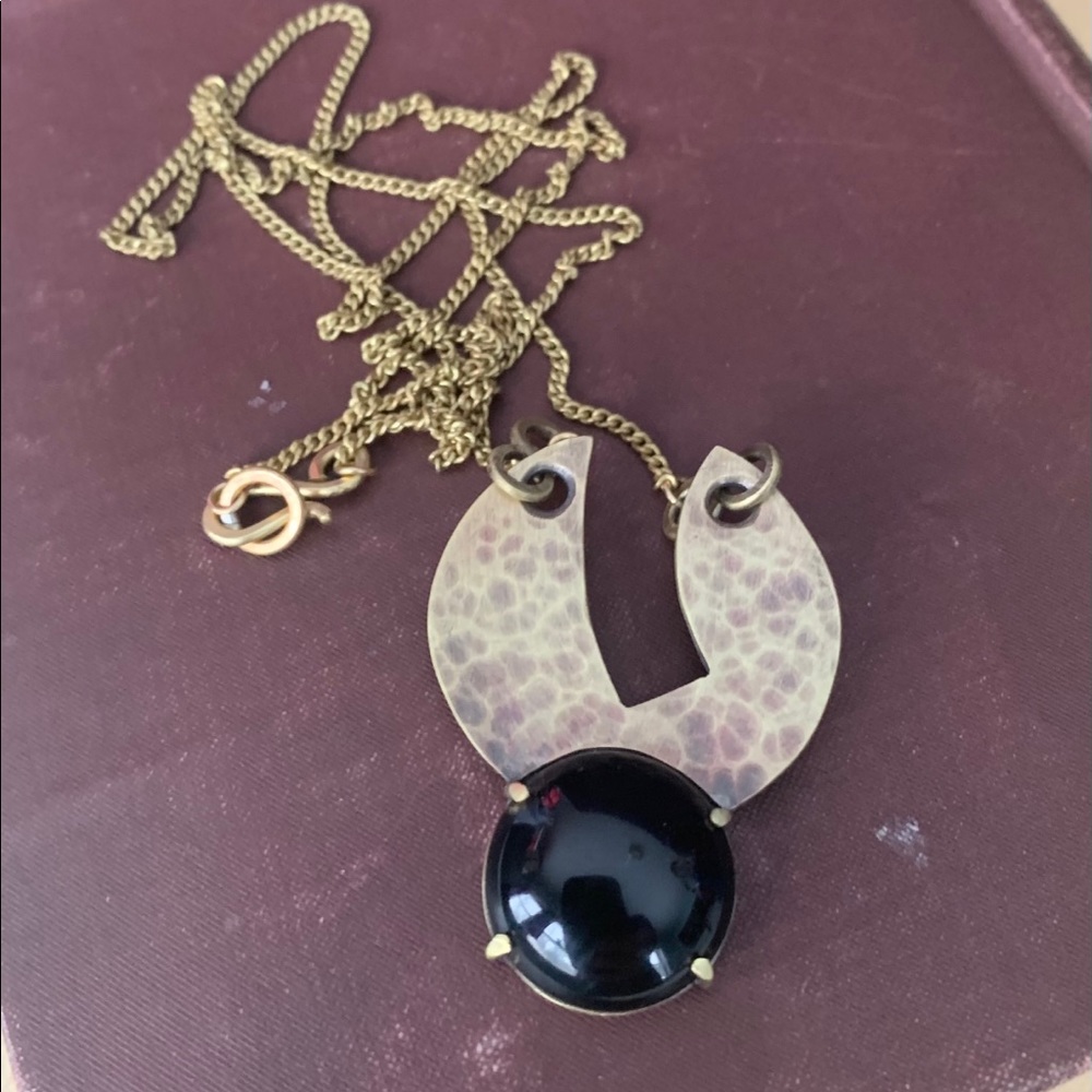 Circle in circle necklace with onyx center stone
